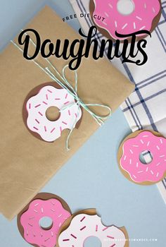 some doughnuts are wrapped in brown paper