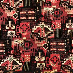 a red and black area rug with different designs on it