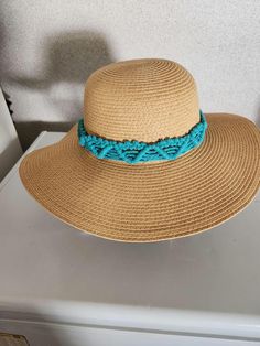 This is a handmade macrame hat band in a teal color. It measures 24" around and has tassels in the back. I can also make this band in other colors as a special order so you can contact me with your request. Does take about a week to get it made and shipped. The hat is for display only. Macrame Hat Band, Macrame Hat, Tyler Tx, Handmade Macrame, Teal Color, Hat Band, Teal Colors, Other Colors, Wedding Shop