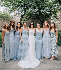 a group of women standing next to each other