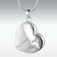 Standard chain/cord included. Looking for a custom fit? Make your selection above! Includes a funnel and instructions to fill and seal the cremation pendant The cremation pendant closes securely with a threaded screw Footprints Heart Solid 14k White Gold Cremation Jewelry Our keepsake pendants bring memories to an even more personal level by holding a small portion of cremated remains, a lock of hair or dried ceremonial flowers. The pendants may be worn or displayed in a glass dome. Easily seals Personalized Memorial Gifts, Mommy Jewelry, Urn Pendant, Memorial Urns, Memorial Necklace, Couple Jewelry, Cremation Jewelry, Gold Vermeil, Beautiful Necklaces