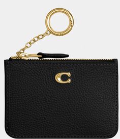 From COACH&#x2C; the Pebbled Leather Mini Skinny ID Case features:Polished pebble leatherCredit card slot and ID windowZip-top closure&#x2C; fabric liningAttached split key ringApprox. 4.25'' L x 3'' HImported. Classic Gold Leather Coin Purse, Elegant Gold Coach Coin Purse, Classic Coach Leather Coin Purse, Coach Leather Coin Purse With Coin Pocket, Elegant Coach Leather Card Holder, Coach Gold Leather Wallet, Coach Black Leather Card Holder, Black Leather Coach Card Holder, Luxury Coach Coin Purse With Card Slots