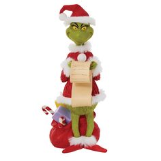 the grinch is holding a piece of paper in his hand