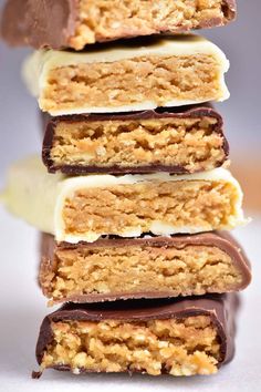 four bars stacked on top of each other with text overlay that reads keto protein bars 4 ingredients, no baking low carb