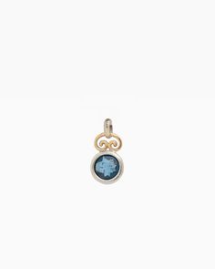 The Blue Moon Pendant combines simplicity with distinctive elegance. It showcases a delicate design, featuring a faceted London blue topaz stone set in sterling silver, complemented by a 14K gold petroglyph detail at the top. Pair with your favorite chain, sold separately. Metal: Sterling silver with 14K gold accent Stone: London blue topaz Dimensions: 18mm x 10mm Style #: P113LB Luxury Sterling Silver Star Of David Jewelry, Elegant Star Of David Birthstone Jewelry, Celestial Blue Topaz Gemstone Jewelry, Celestial Blue Topaz Jewelry Gift, Celestial Blue Topaz Jewelry For Gift, Celestial Style Blue Topaz Jewelry For Gift, Modern Hallmarked Blue Topaz Jewelry, Yellow Gold Jewelry With Round Blue Topaz, Modern Gold Jewelry With Blue Topaz