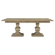 a wooden table with two pedestals on each side