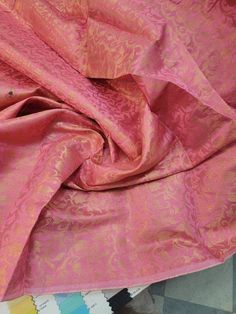 "Handcrafted beautiful silk brocade with mettallic thread thread work swirly and floral soft fabric usable for apparel,accessories and interior designs. . Beautifully made to use for costumes, dance wear, decorations, weddings and much more. Width : 45\" inches Color : Rose pink with gold Thank you for your coming! Please read policy before placing an order. Please contact us via ETSY Conversations for more details. Fabrics are sold by the yard. We will continue length of multiple yards . It wil Indian Fabric, Fabric Suppliers, Silk Brocade, Brocade Fabric, Thread Work, Pink Silk, Couture Collection, Vintage Silk, Dance Wear