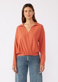 Keep it effortlessly chic this Fall in our surplice front blouse. A casual top with endless styling possibilities. Featuring a flattering surplice v-neckline, a classic collar neckline, and a relaxed silhouette. This versatile top is perfect for the office or post-work cocktails! Linen blend Relaxed fit Long sleeve Dropped shoulder Button cuff closure V-neckline Collared neckline Hook & eye closure Half elastic waist at the back Dry clean recommended or hand wash cold Model is 5'7.5, wearing a s Modern V-neck Blouse For Fall, Modern V-neck Top For Spring, Trendy V-neck Top With Twist Front, Effortless Fall V-neck Blouse, Effortless V-neck Blouse For Fall, Versatile V-neck Tops For Layering, Fall V-neck Wrap Top For Layering, Solid Color V-neck Faux Wrap Top, Modern V-neck Blouse For Work