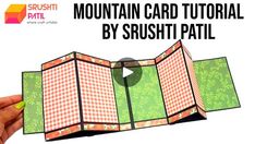 a hand holding an open card with the text mountain card tutor by srushti patil