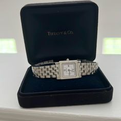 Tiffany Stainless Steel Vintage Watch With Box Timeless Analog Jewelry And Watches As Gift, Timeless Silver Watch Accessories With Original Box, Classic Watch With Box Clasp For Anniversary, Classic Diamond Watch For Gift, Formal Silver Watch Accessories With Original Box, Classic White Gold Jewelry With Original Box, Classic Silver Watch Accessories With Original Box, Classic Diamond Watch With Subdials As Gift, Timeless White Gold Watch Accessories For Gift