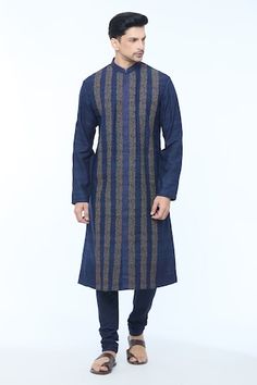 Navy blue full sleeves handloom silk kurta with striped Gul vine embroidery all over. Paired with a churidar. - Aza Fashions Blue Chanderi Long Sleeve Bandhgala, Blue Long Sleeve Chanderi Bandhgala, Long Sleeve Indigo Kurta For Festive Occasions, Indigo Traditional Wear With Zari Work Long Sleeve, Designer Traditional Wear With Long Sleeves In Tussar Silk, Blue Raw Silk Bandhgala For Designer Wear, Tussar Silk Designer Kurta With Long Sleeves, Designer Tussar Silk Long Sleeve Kurta, Designer Long Sleeve Tussar Silk Kurta