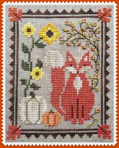 a cross stitch pattern with an image of two foxes and sunflowers on it