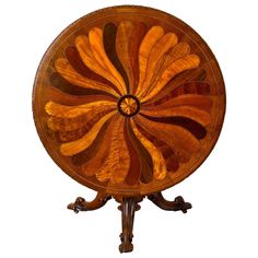 a wooden table topped with an orange and brown flower design on it's side