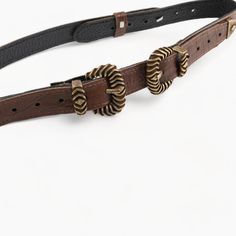 Enhance your wardrobe with this sophisticated brown leather belt, featuring a striking double bronze buckle. Crafted from high-quality genuine leather in Greece, this belt is designed to stand out with its distinctive design and elegant appeal. Measuring 2.5 cm (1 inch) in width, it offers a sleek fit that complements both casual and formal outfits, making it a versatile addition to any collection. The dual buckle design in bronze adds a unique touch, ensuring this belt becomes a standout access Luxury Brown Belt With Buckle Closure, Chic Brown Belt With Buckle Closure, Elegant Brown Belt Buckle, Chic Leather Belt Buckles With Antique Buckle, Chic Leather Belt Buckle With Antique Detail, Chic Leather Belt Buckle With Antique Design, Brown Belt Buckle With Buckle Closure For Formal Occasions, Brown Formal Belt Buckle With Buckle Closure, Formal Brown Belt Buckle With Buckle Closure