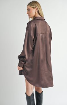 The Edi Flawless Oversized Shirt Dress is a sleek and versatile piece in a rich brown hue. Featuring a stylish collared v-neckline, it adds a touch of sophistication to any outfit. This dress can be worn alone with boots, or you can spice it up and put a belt over-top! Item Details: Sleeveless Collared V-Neckline Button Front Front Pocket Mini Length Fabric Content: 97% Polyester, 3% Spandex Fit Details: We find the Edi Shirt Dress fits true to size. Made under fair working conditions in China. Fall Workwear, Casual Bodysuit, Oversized Shirt Dress, Yarn Sweater, Pointelle Sweater, Fall Jeans, Dressy Pants, Brown Shirt, Overalls Pants