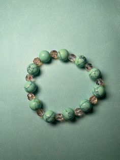 Light green howlite bead bracelet with pink gem stones. This bracelet was inspired by Haruki Murakami novels I've read and the beauty of spring. It has an enchanting feel and I absolutely love the pink and green tones coming together. This gift is great for a special birthday gift. #greenhowlite #greenpinkbracelet #greenpinkaesthetic #handmadebracelets #uniquedesignbracelets Green Themed Beaded Bracelets, Handmade Green Beaded Bracelet, Fun Style, Handmade Green Jade Bracelets, Whimsical Green Beaded Bracelets, Hand-strung Green Jade Beaded Bracelets, Special Birthday Gifts, Haruki Murakami, Pink Gem, Green Tones