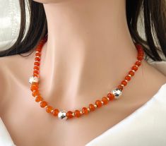 Gorgeous Faceted Orange Carnelian Necklace in 925 Sterling Silver with Earrings included  Big size 10 mm and 8 mm Faceted Carnelian and 3 Hammered Sterling Silver Balls 12 mm  Elegant  , Trendy and Stylish ! Complements any Outfit  Necklace Length : 20 inches Carnelian Stones : 8 mm to 10 mm  Lobster clasp Closure Sterling Silver 925 Earwire earrings Orange Carnelian Jewelry For Anniversary, Orange Sterling Silver Jewelry With Round Beads, Faceted Carnelian Jewelry Gift, Orange Faceted Jewelry Gift, Handmade Orange Jewelry For Birthday, Valentines Birthday, Orange Carnelian, Carnelian Necklace, Carnelian Stone