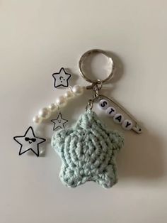 a crocheted keychain with a star on it