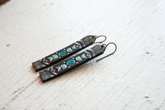 Moon Phases Leather Earrings Long Tooled Turquoise and Black | Etsy Artistic Black Jewelry For Festival, Black Bohemian Hand-tooled Jewelry, Black Hand Tooled Bohemian Jewelry, Black Hand-tooled Bohemian Jewelry, Unique Hand Tooled Black Jewelry, Turquoise And Black, Leather Scraps, Inspired Jewelry, Earrings Long