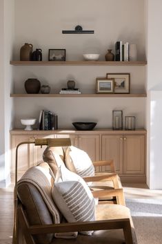 a living room filled with furniture and shelves