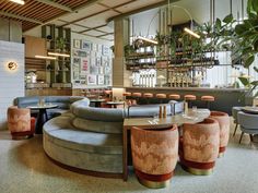 the interior of a restaurant with circular seating