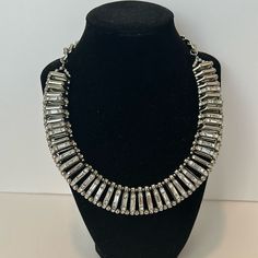 Nwt Chico's Kimmi Collar Pave Crystal Silver Cubic Zirconia Necklace Brand New With Tag 16” Length Adjusts From 16"-20" Style: 570160215 Add Dimension To Your Look With This Bib Necklace. Silver-Tone Trapezoids Are Linked And Topped With Glass Stones To Create This Amazing Style. Pet/Smoke Free Home Adjustable Silver Rhinestone Necklace, Adjustable Costume Crystal Necklaces For Party, Jeweled Crystal Necklaces For Parties, Crystal Necklaces With Rhinestones In Costume Jewelry Style, Rhinestone Crystal Costume Necklace, Adjustable Metal Necklace With Sparkling Stones, Formal Rhinestone Bling Necklace In Metal, Beaded Metal Crystal Necklaces For Parties, Formal Rhinestone Necklace With Bling