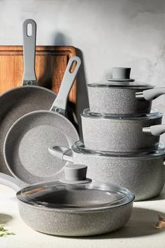 an assortment of pots and pans on a counter