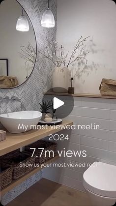 a bathroom with a round mirror above the sink