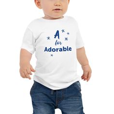 "Introducing the cutest addition to your little one's wardrobe, the \"A for Adorable\" baby t-shirt! This shirt is designed with love and care for your precious little angel.  So get your baby this short sleeve cotton jersey tee that's not only stylish, but also comfy, durable, and easy to clean. * 100% combed ring-spun cotton * Heather colors are 52% combed ring-spun cotton, 48% polyester * Fabric weight: 4.2 oz/yd² (142 g/m²) * Pre-shrunk fabric * 32 singles * Relaxed fit * Side-seamed construction * Colors may differ depending on your computer or phone settings * Please use the size guide below to find the right fit. Artwork copyright @ 2023 by Barlei Rapid. This product is made especially for you as soon as you place an order, which is why it takes us a bit longer to deliver it to you. Blue Short Sleeve T-shirt For First Birthday, Cute T-shirt With Name Print For Gift, Playful Short Sleeve T-shirt For First Birthday, Blue Cotton T-shirt For First Birthday, Cute Name Print T-shirt For Gift, Cute T-shirt With Name Print As Gift, Cute White T-shirt For First Birthday, Cute Blue T-shirt For Gift, Youth Clothing