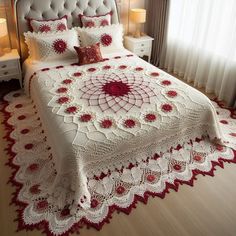 a white and red crocheted bedspread on a bed in a bedroom