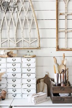 an old dresser with lots of crafting supplies on it