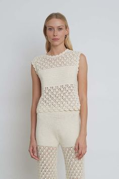 The sarah crochet is a relaxed shell top in a modern graphic open-lace stitch with coverage at the front bust and a playful back keyhole detail. style effortlessly back to your favorite high-waist pant or style with the matching rebecca crochet pant as a sleek knit-set.    detail:    - hand crochet in peru with love  - made from 100% peruvian cotton  - graphic open crochet  lace-stitch with filled in crochet coverage at front bust.  - crew neck at front  w/ back neck tie at back scooped out key- High Neck Crochet Top, Crochet Pant, Wrap Clothing, Crochet Pants, Cashmere Accessories, Shell Top, Shell Tops, Pullover Cardigan, Sun With Sunglasses