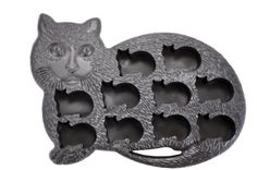 a cat shaped cake pan with holes in it