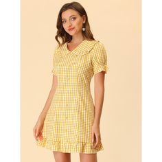 Look as cute as you do cool and collected in this Peter Pan collar dress. This fanciful Peter Pan collar mini dress is designed with a sweet collar and ruffled skirt. The beautiful gingham print dress has short puff sleeves and a mini-length skirt finished with a soft ruffle hem. Walk with a brisk in your step in the Gingham Print Wrap Mini Dress and be the center of everyone's attention. Spring Preppy Mini Dress, Preppy Mini Dress For Spring, Summer Mini Dress With Ruffles And Doll Collar, Mini Length Plaid Dress With Ruffles, Short Sleeve Plaid Dress With Ruffles For Picnic, Cute Knee-length Mini Dress With Ruffle Hem, Short Sleeve Mini Dress With Ruffles For Picnic, Cute Ruffled Plaid Dress For Spring, Cute Fitted Mini-length Plaid Dress