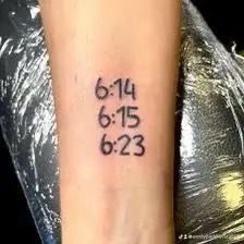 a woman's wrist with a tattoo that reads 6 / 4 / 13 and has numbers on it