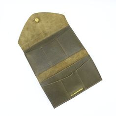 Olive GreenTHE wallet. Functions like a dream, holds all you need, doubles as a clutch. Available in a myriad of colorful leather options, so you can choose the one that is perfectly you. This classic design features 6 credit card slots, a compartment for organizing bills and receipts, and a back zippered coin pocket— all in a slender silhouette. The sleeve of this wallet also holds your phone, so feel free to carry it solo anytime you feel like getting dressed up. Available in soft chrome tanne Green Wallets With Interior Card Slots, Everyday Green Wallets With Interior Card Slots, Classic Green Trifold Wallet For Everyday Use, Modern Bifold Clutch With Card Slots, Trifold Wallet With Interior Card Slots For Travel, Green Trifold Travel Wallet, Green Trifold Wallet With Card Slots For Everyday Use, Green Travel Wallets With Card Slots, Green Trifold Wallet For Daily Use