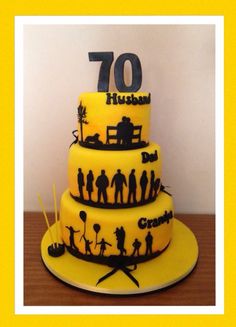 a yellow and black cake with the number 70 on it's top tier is decorated with silhouettes of people