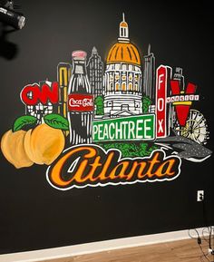 there is a mural painted on the wall of this restaurant in atlanta, where peaches are served