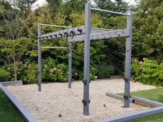 an outdoor volleyball court with sand and gravel