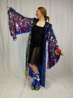 This sparkling maxi length kimono robe with bell sleeves is sure to make you stand out in the crowd. The iridescent holographic color shifting sequins catch sunlight and reflect a rainbow of colors all around you. These sleeves are incredible and like no other sequin kimono out there. It looks great on stage and is very demanding of attention. All eyes on you! It wears great from day to night, is unlined, and has a mesh foundation so it does not get too hot while you are dancing your heart out a Long Multicolor Party Kimono, Multicolor Long Sleeve Party Kimono, Multicolor Long Sleeve Kimono For Party, Rave Kimono, Plus Size Rave, Holographic Color, Burning Men, Sequin Kimono, Burning Man Costume