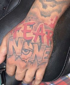 a hand with the word fear now painted on it