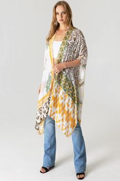 Boho kimono with bold geometric prints.Ultra light, draping open-front. Light and billowy silhouette, perfect for effortless layering. CARE | Hand Wash Cold or Dry Clean CONTENTS | 100% Viscose MEASUREMENTS | 36"/91 cm Top to Bottom (Size O/S) MODEL | 5'8 - wearing O/S IMPORTED Multicolor Open Front Kaftan For Spring, Spring Multicolor Open Front Kaftan, Bohemian Kimono With Abstract Print For Vacation, Patterned Flowy Kimono With Kimono Sleeves, Flowy Open Front Printed Cover-up, White Open Front Bohemian Kaftan, Patterned Printed Cover-up, Open Front One Size Kaftan, White Flowy Kimono With Kimono Sleeves