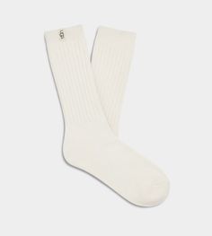 These ultra-soft knit socks are a fan favorite. The Rib Knit Slouchy Crew sock is the perfect combo of texture and style. | Soft knit crew sock. 99% Recycled Polyester/1% Elastane. 11 inch height. Soft twill tape with The UGG® Logo on top cuff. Fits shoe size: 5-10. Imported. | UGG® Women's Rib Knit Slouchy Crew Sock Polyester Blend/Recycled Materials Socks in White/ Ugg Socks, Tall Boot Socks, Pom Pom Shorts, Pom Pom Slippers, Short Rain Boots, Outfit Inspo Casual, Over The Knee Socks, Cozy Socks, Crew Sock