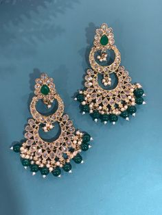 High quality polki earring. About 2 inch long and 2inch wide. Temple Jewelry Stone Work Drop Earrings, Temple Jewelry Stone Work Dangle Earrings, Heavy Chandbali Chandelier Earrings In Metal, Temple Jewelry Chandbalis With Pierced Ears In Kundan, Metal Chandbali Chandelier Earrings, Bollywood Style Meenakari Metal Earrings, Kundan Pearl Drop Danglers, Kundan Chandbali Bridal Earrings, Temple Jewelry Kundan Dangle Earrings