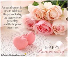 pink roses and two hearts on a white doily with an anniversary card in the middle