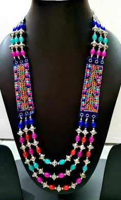 "Enjoy wearing this colorful, joyful novelty multi strand jelly bean necklace, in bright, fun colors. It looks good enough to eat! Great gift for grandmother - bright colors and light weight, no strain on her neck. Easy to pack, it is perfect for travel, tropical vacation, beach wear, resort wear, cruise wear. Gold colored crystals add bling! Looks great on everyone! Kick your wardrobe up a notch! - length 12 -14\", adjustable via sliding bead to 19\" - detailed silver tone beads add interest - Handmade Multicolor Layered Necklace For Gift, Multicolor Double Strand Beaded Necklace For Beach, Handmade Multicolor Layered Necklace As Gift, Vibrant Large Beaded Jewelry For Festivals, Multicolor Long Necklace For Summer, Fun Multicolor Beaded Necklace With Large Beads, Fun Multicolor Beaded Chain Jewelry, Playful Festival Jewelry With Colorful Beads, Bohemian Multicolor Double Strand Beaded Necklaces