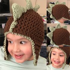 the child is wearing a crocheted hat with horns