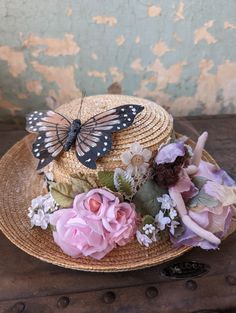 This hat is perfect for wand through the garden, dancing with the fairies or having a tea party. Or wear it as a statement piece to summer wedding, or maybe a derby party? Vintage mesh from a fascinator, silk flowers, vintage buttons and a handmade fairy doll. Upcycled straw hat in excellent condition. Inner brim is 7.5 inches long and 7 inches wide. Garden Hat Ideas, Garden Party Hats For Women, Bohemian Adjustable Sun Hat For Garden Party, Adjustable Bohemian Sun Hat For Garden Party, Whimsical Flower-shaped Fascinator With Handmade Flowers, Bohemian Straw Hat For Garden Party, Summer Garden Party Fascinator With Short Brim, Bohemian Straw Hat With Short Brim For Garden Party, Summer Beach Fascinator