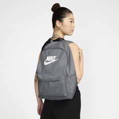 Take your gear to go with the Nike Heritage Backpack. Its spacious main compartment features a sleeve that holds up to a 15" laptop, so your computer is never out of reach. 2 zippered accessories pockets help keep your gear organized and easy to grab. This product is made with at least 65% recycled polyester fibers. Nike Bookbag, Nike Heritage Backpack, Air Mac, Nike Backpack, Gear Organizer, Small Item Storage, Commute To Work, Heritage Backpack, Grey Nikes