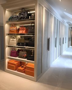 the closet is full of handbags and purses